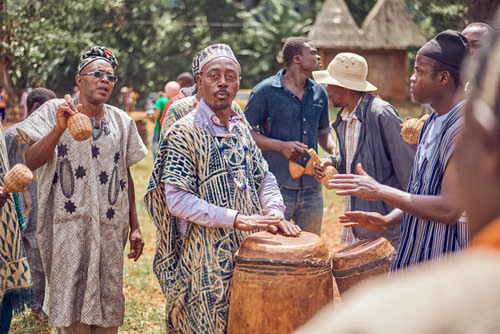 Musicians playing traditional drums and shakers