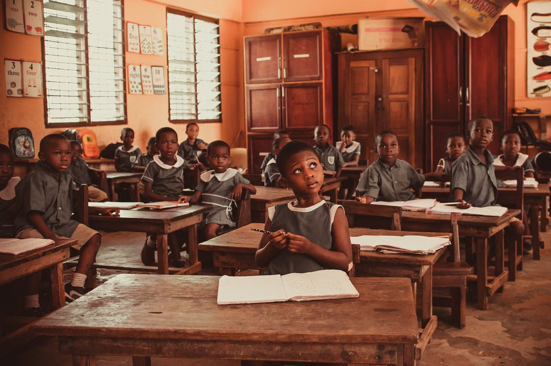 Pupils at their desks in a classroom